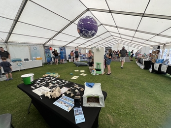 An image showing The Festival of the Sea main tent, with informative stalls.