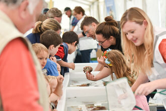 Image of the tanks at Festival of the Sea with children and adults looking. 