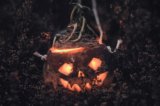 Turnip Moot lit by candle with a face carved into it