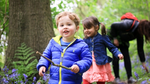 Child with wand (stick) in hand