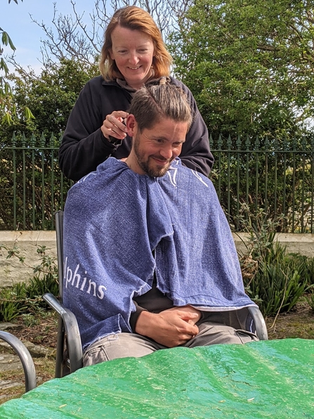 Lara giving Rob a haircut