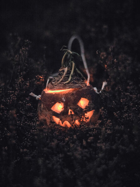 Turnip Moot lit by candle with a face carved into it