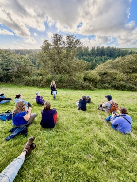 The attendees of the Temperate Rainforest Conference learning about Lichen. 